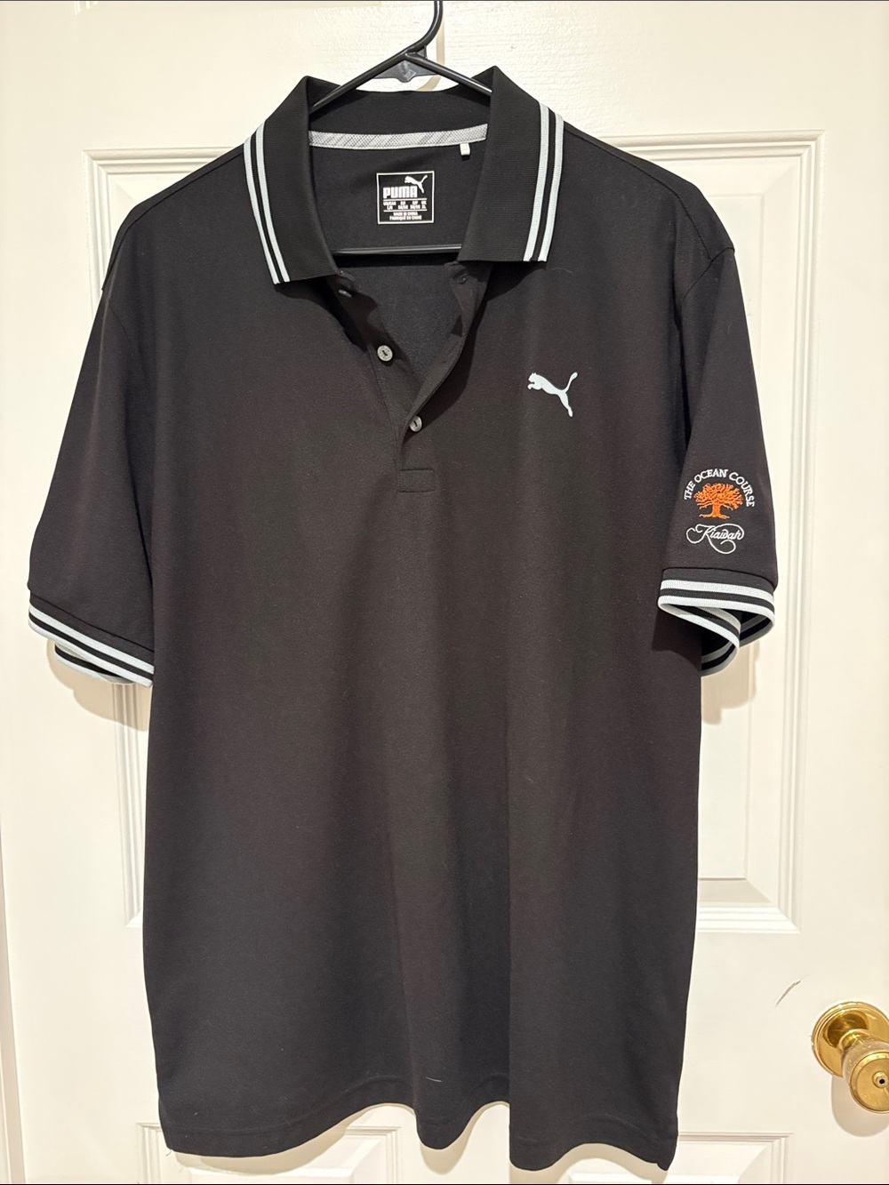 Puma Black Golf Shirt with White Trim and Kiawah Logo from The Ocean Course!